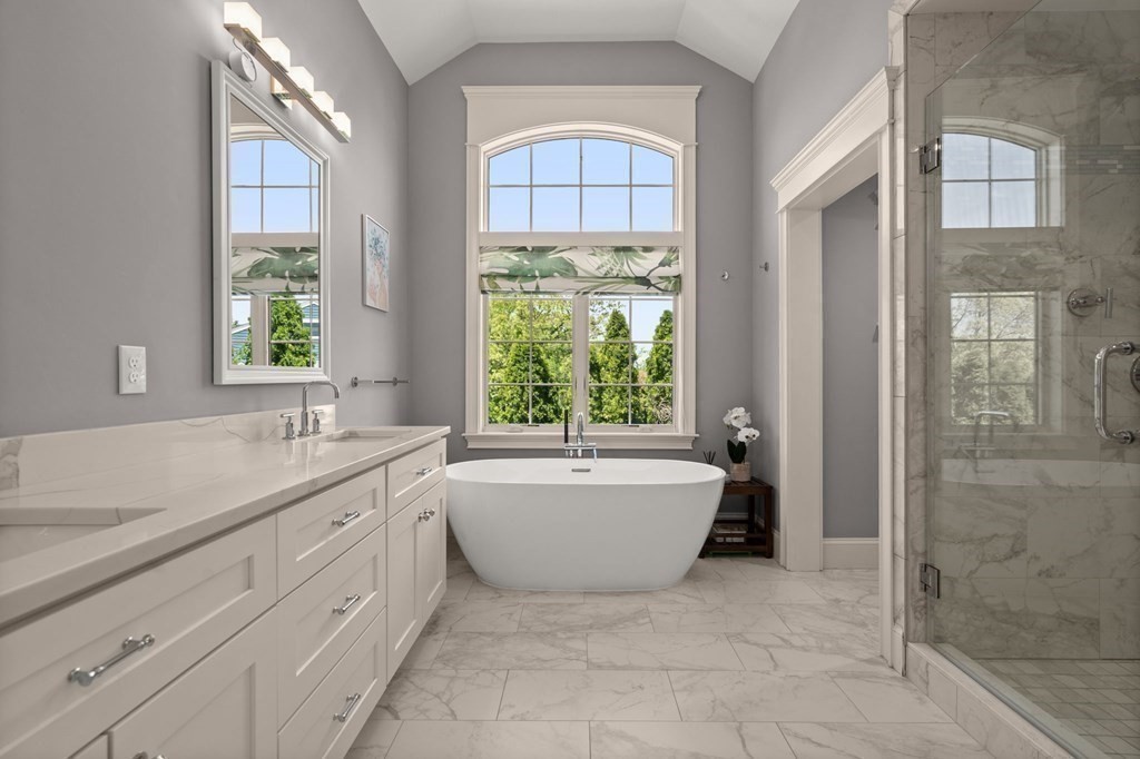 303 Hartman Road Newton, MA 02459 - Photo 16 of 39 a bathroom with a granite countertop tub sink and mirror