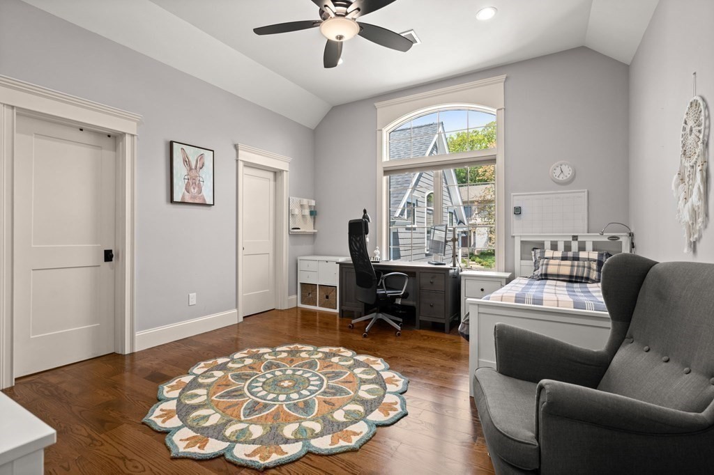 303 Hartman Road Newton, MA 02459 - Photo 20 of 39 a living room with furniture and a large window