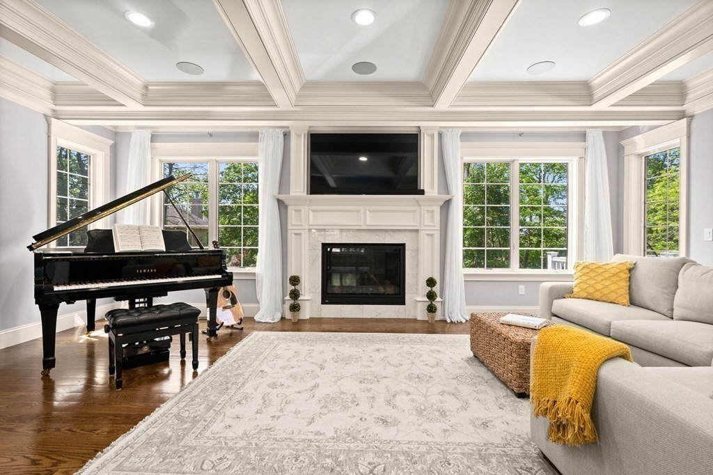 303 Hartman Road Newton, MA 02459 - Photo 2 of 39 a living room with furniture and a fireplace