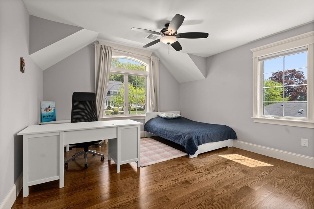 303 Hartman Road Newton, MA 02459 - Photo 23 of 39 a living room with furniture and a fireplace