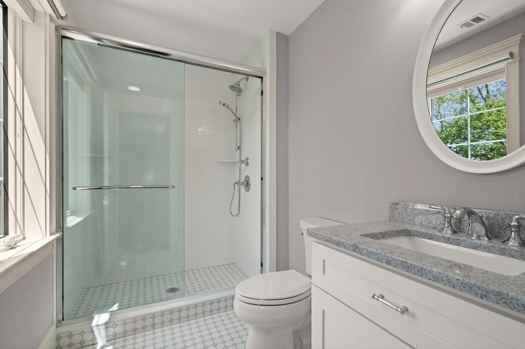 303 Hartman Road Newton, MA 02459 - Photo 26 of 39 a bathroom with a granite countertop sink toilet and shower