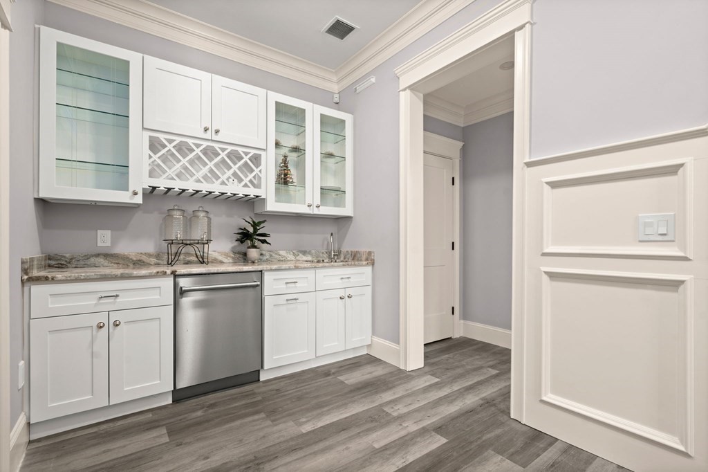 303 Hartman Road Newton, MA 02459 - Photo 28 of 39 a kitchen with granite countertop white cabinets and white appliances