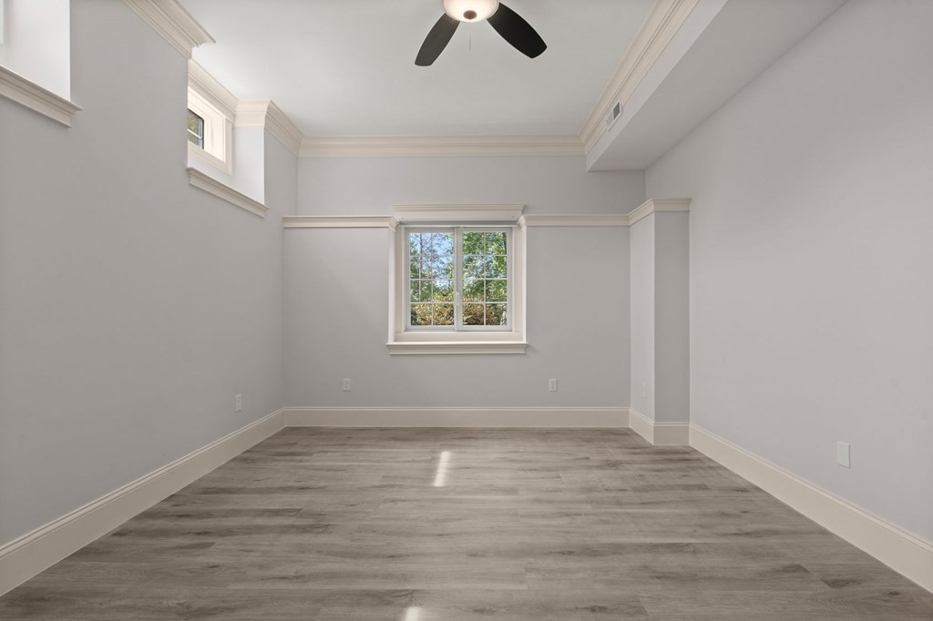 303 Hartman Road Newton, MA 02459 - Photo 29 of 39 wooden floor in an empty room with a window