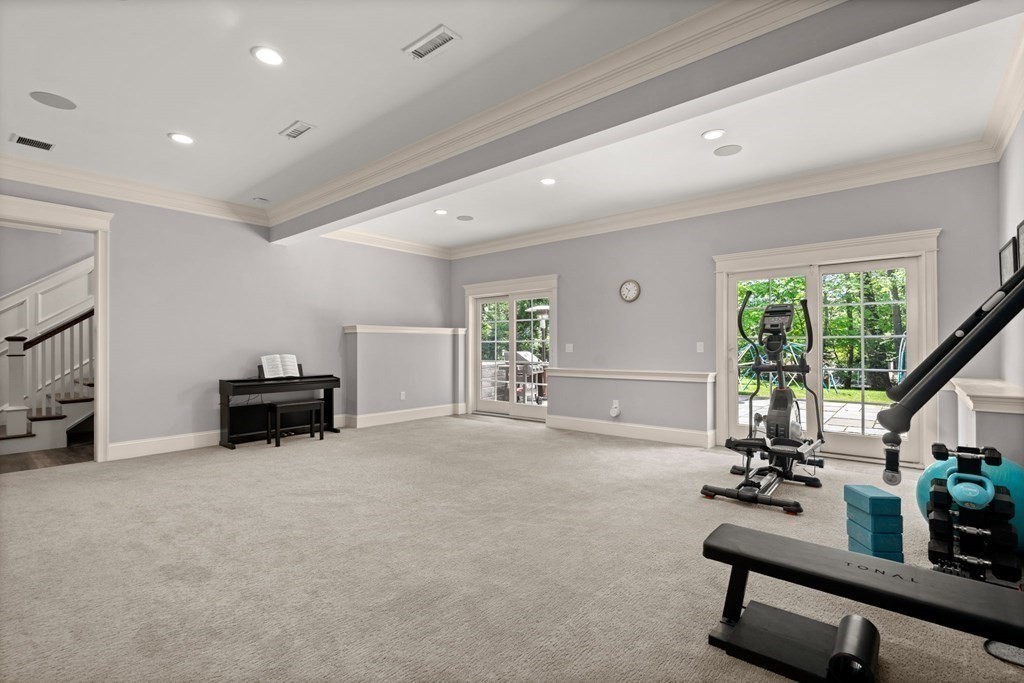 303 Hartman Road Newton, MA 02459 - Photo 31 of 39 a room with gym equipment and a large window