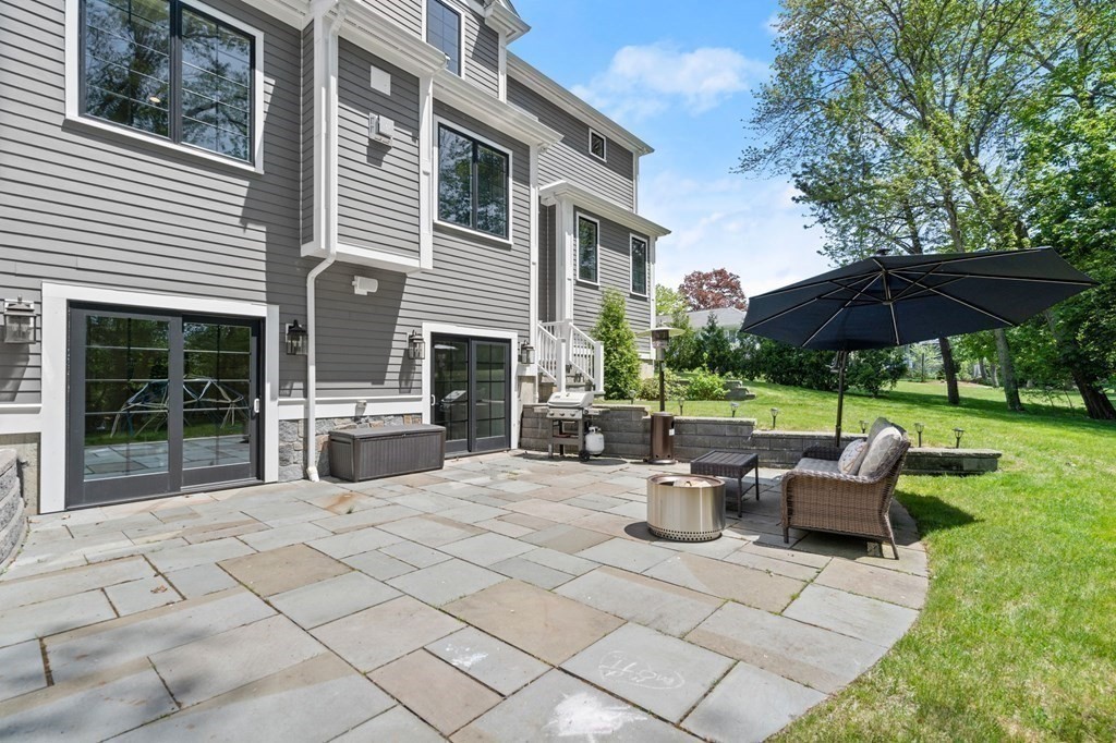 303 Hartman Road Newton, MA 02459 - Photo 33 of 39 a view of backyard of house with seating space