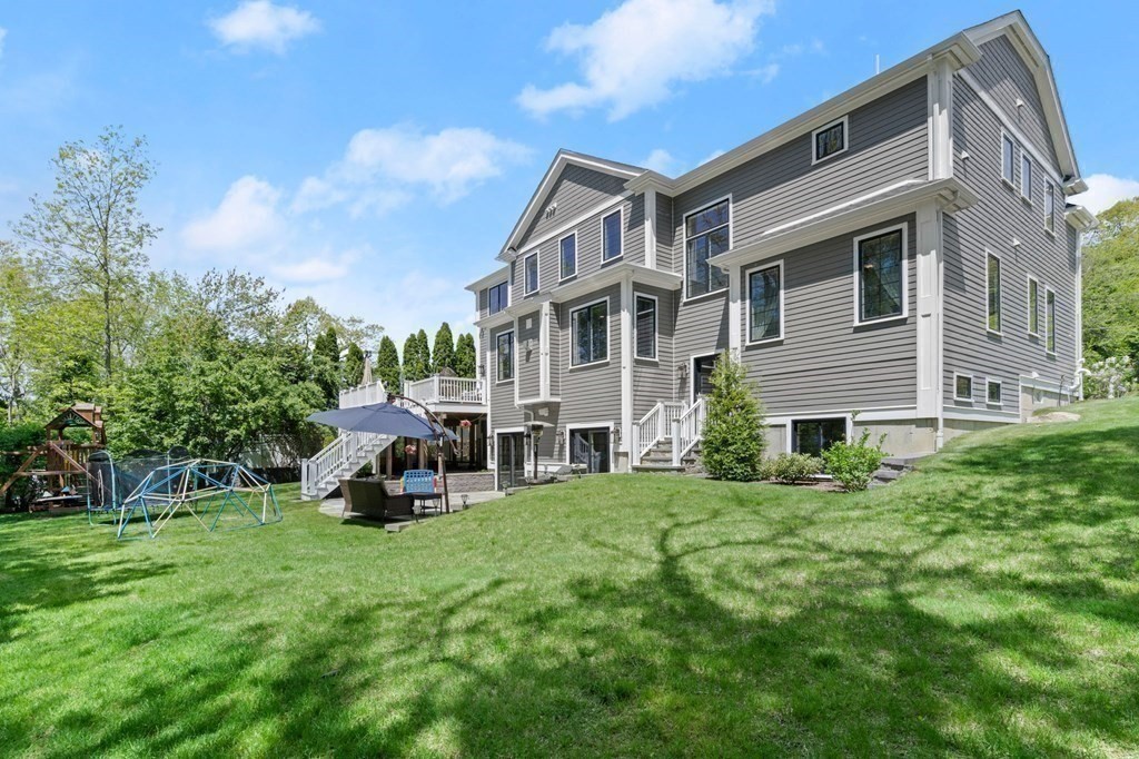 303 Hartman Road Newton, MA 02459 - Photo 34 of 39 a view of a house with a yard