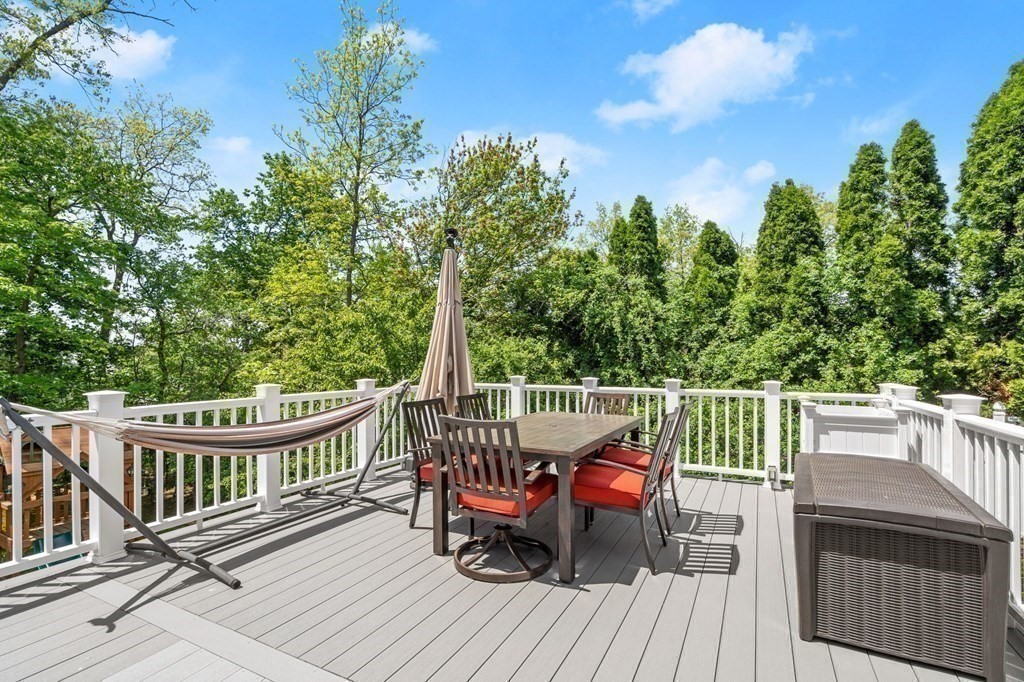 303 Hartman Road Newton, MA 02459 - Photo 36 of 39 a view of a deck with two chairs and wooden floor