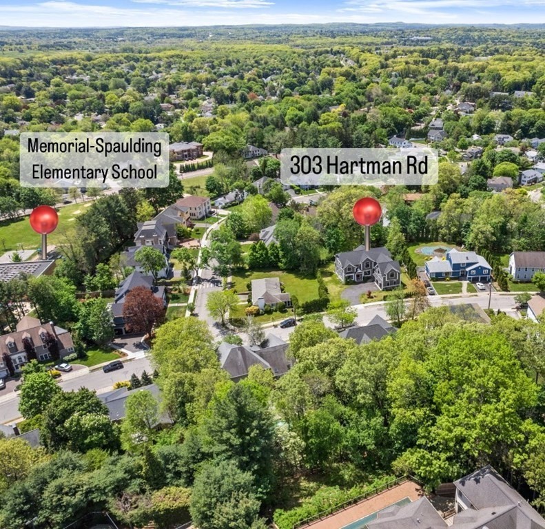 303 Hartman Road Newton, MA 02459 - Photo 38 of 39 a sign that is sitting in the middle of a field