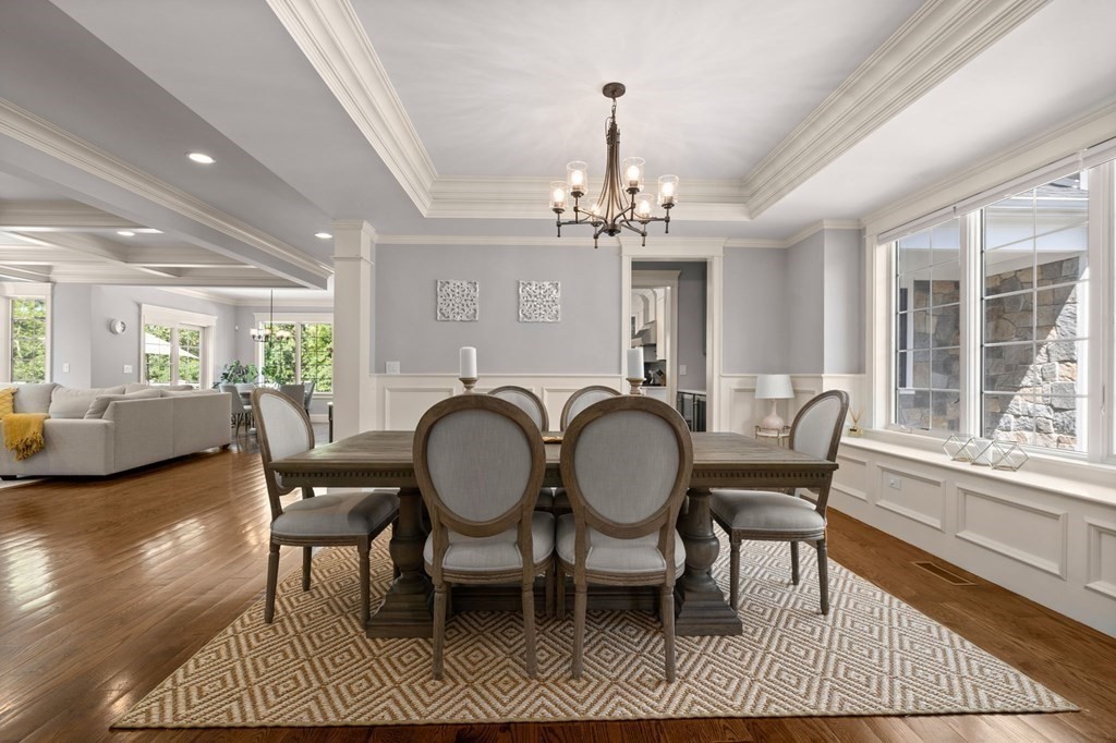 303 Hartman Road Newton, MA 02459 - Photo 9 of 39 a view of a dining room with furniture a rug and wooden floor