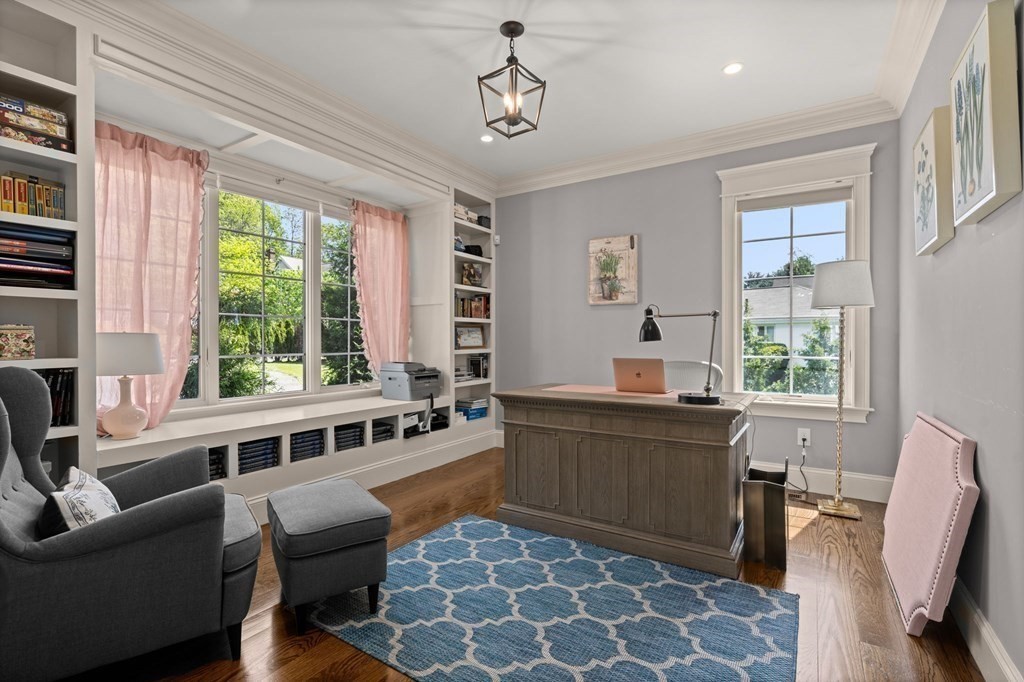 303 Hartman Road Newton, MA 02459 - Photo 10 of 39 a kitchen with stainless steel appliances granite countertop a sink and wooden cabinets