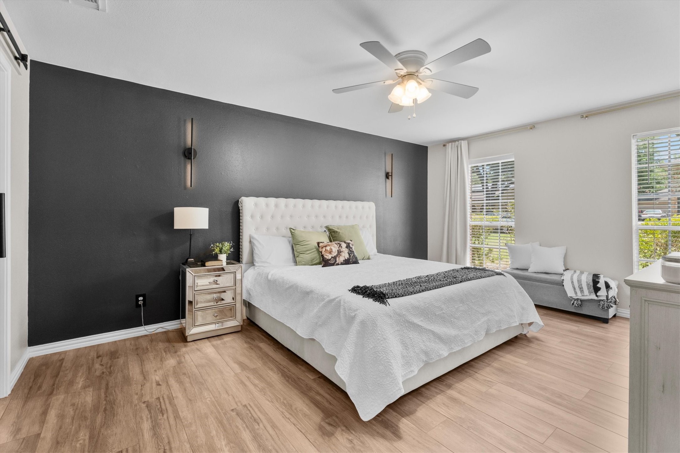 4026 Oxhill Road Spring, TX 77388 - Photo 22 of 40 Located at the front of the home, the spacious primary suite offers plenty of room for a king-sized bed and additional seating. Large windows fill the room with natural light, creating a bright and relaxing retreat.