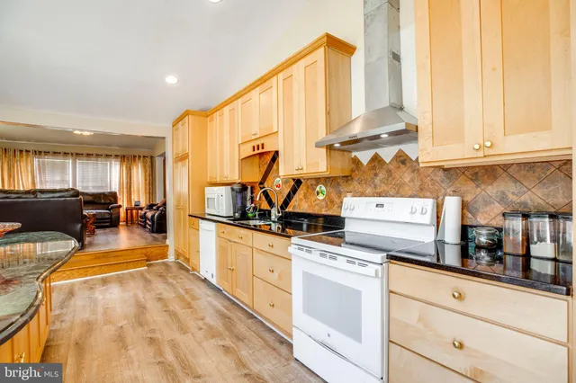 a dining room with furniture and a potted plant