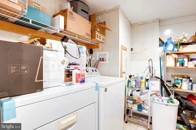a bathroom with a sink mirror vanity and toilet