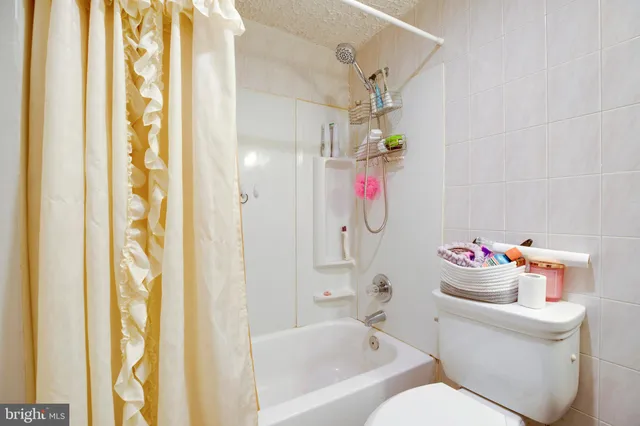 a bathroom with a sink vanity and a mirror