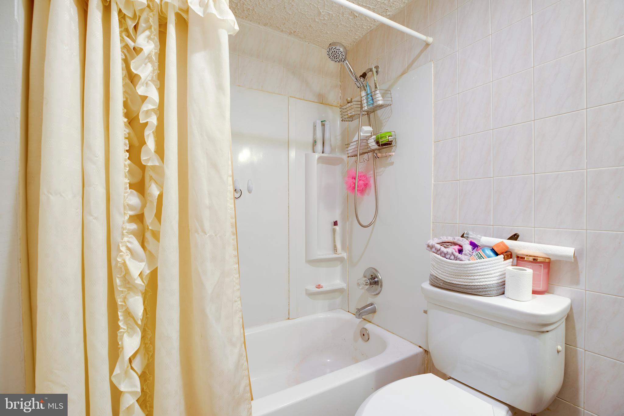 10009 Bent Tree Lane Manassas, VA 20111 - Photo 36 of 41 a bathroom with a sink mirror vanity and toilet