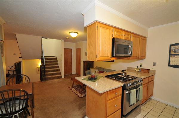 17 Treasure Way, Unit 17 Ashland, MA 01721 - Photo 11 of 27 a kitchen that has a sink and a stove top oven