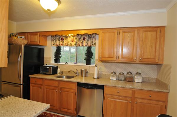 17 Treasure Way, Unit 17 Ashland, MA 01721 - Photo 12 of 27 a kitchen with granite countertop a refrigerator sink and cabinets