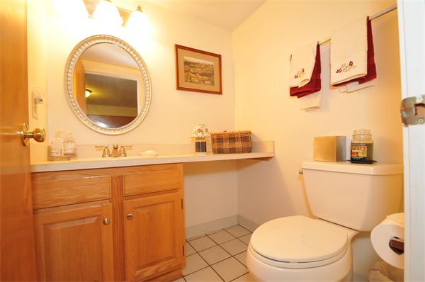 17 Treasure Way, Unit 17 Ashland, MA 01721 - Photo 14 of 27 a bathroom with a toilet sink and mirror