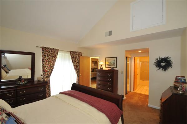 17 Treasure Way, Unit 17 Ashland, MA 01721 - Photo 20 of 27 a bedroom with a bed and a dresser
