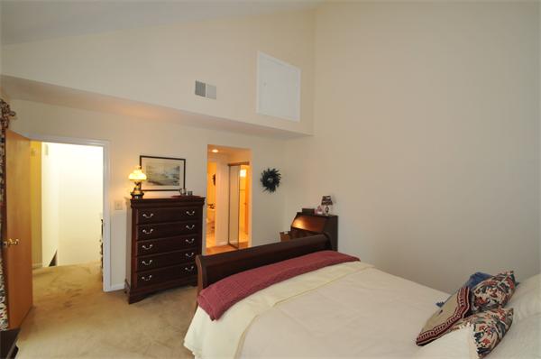 17 Treasure Way, Unit 17 Ashland, MA 01721 - Photo 21 of 27 a bedroom with a bed and a lamp