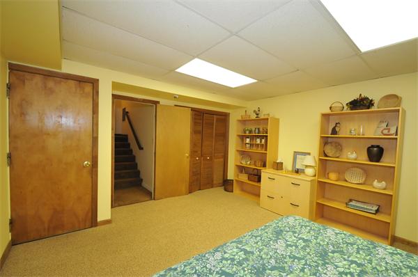 17 Treasure Way, Unit 17 Ashland, MA 01721 - Photo 23 of 27 a bedroom with a bed and furniture