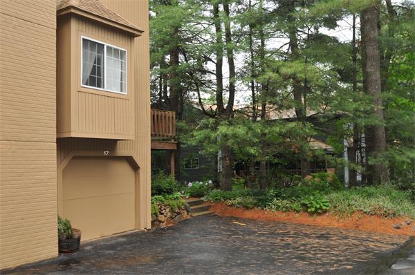 17 Treasure Way, Unit 17 Ashland, MA 01721 - Photo 27 of 27 a backyard of a house with plants and trees