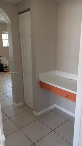 a bathroom with a tub and sink