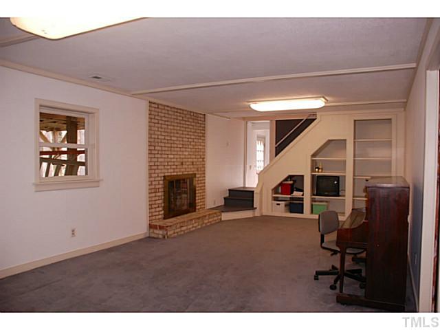 1507 Stonehurst Road Raleigh, NC 27607 - Photo 15 of 23 a view of a livingroom with furniture and staircase