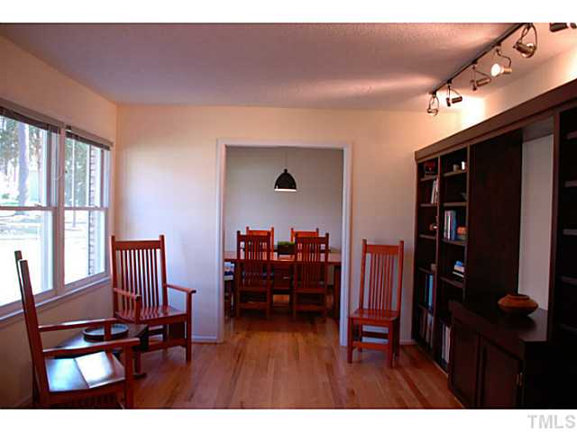 1507 Stonehurst Road Raleigh, NC 27607 - Photo 2 of 23 a view of a livingroom with furniture window and a ceiling fan