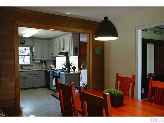 1507 Stonehurst Road Raleigh, NC 27607 - Photo 4 of 23 a kitchen view of living room and dining room
