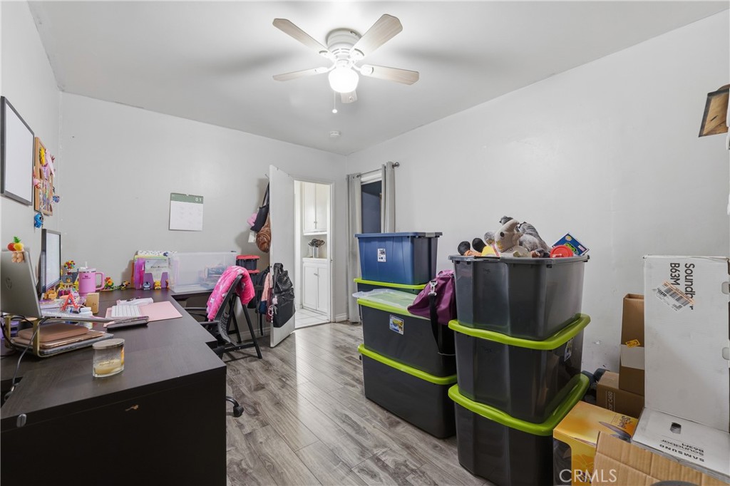 12817 Zeus Avenue Norwalk, CA 90650 - Photo 15 of 36 a living room with furniture and a flat screen tv