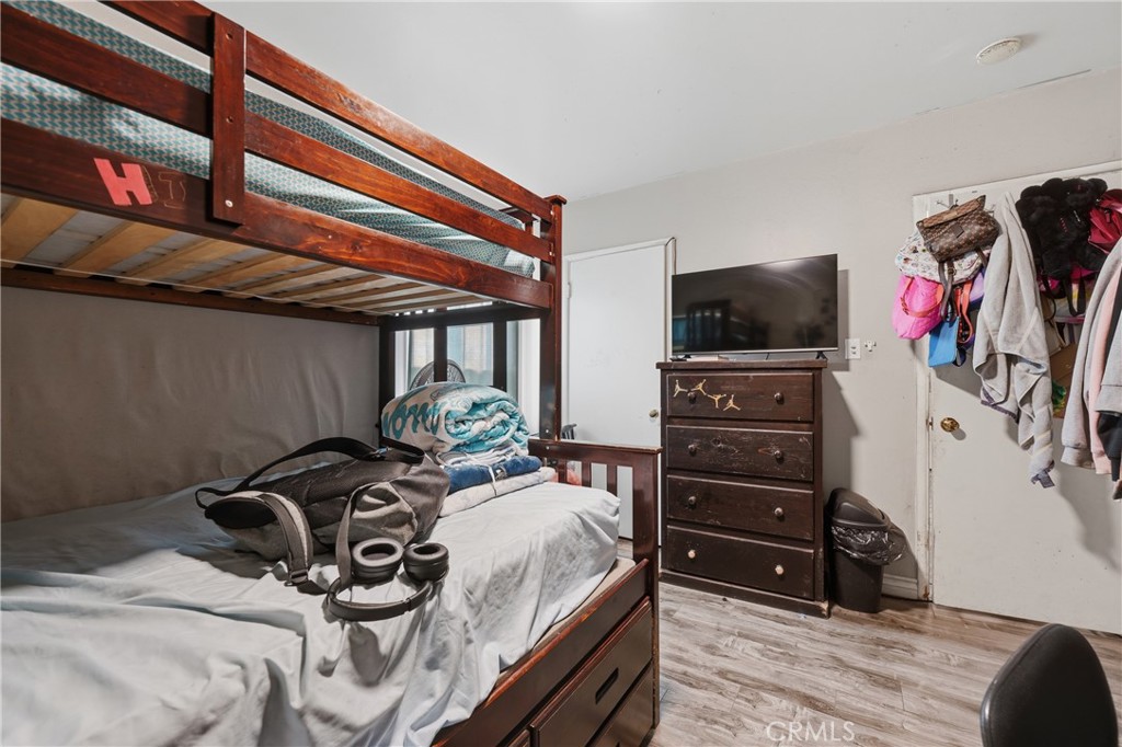 12817 Zeus Avenue Norwalk, CA 90650 - Photo 20 of 36 a bedroom with a bed and a flat screen tv