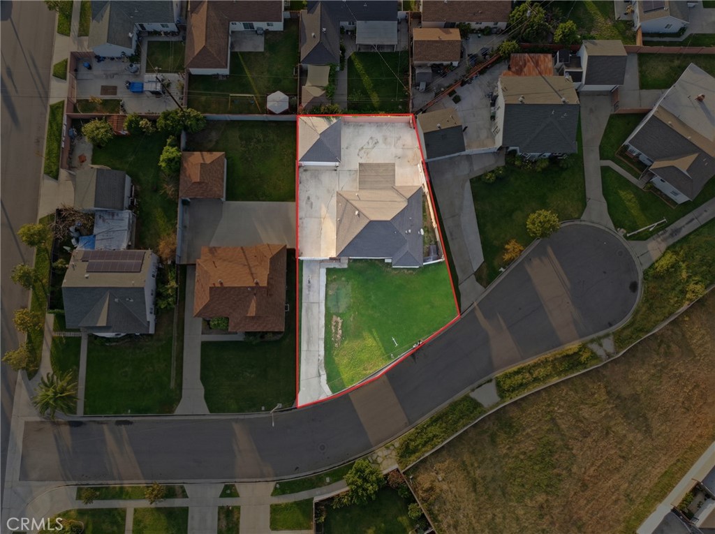 12817 Zeus Avenue Norwalk, CA 90650 - Photo 30 of 36 an aerial view of a house with outdoor space