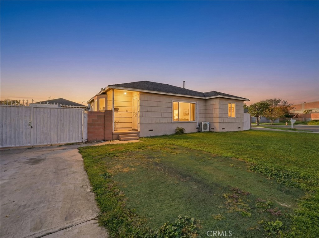 12817 Zeus Avenue Norwalk, CA 90650 - Photo 3 of 36 a front view of house with yard and green space