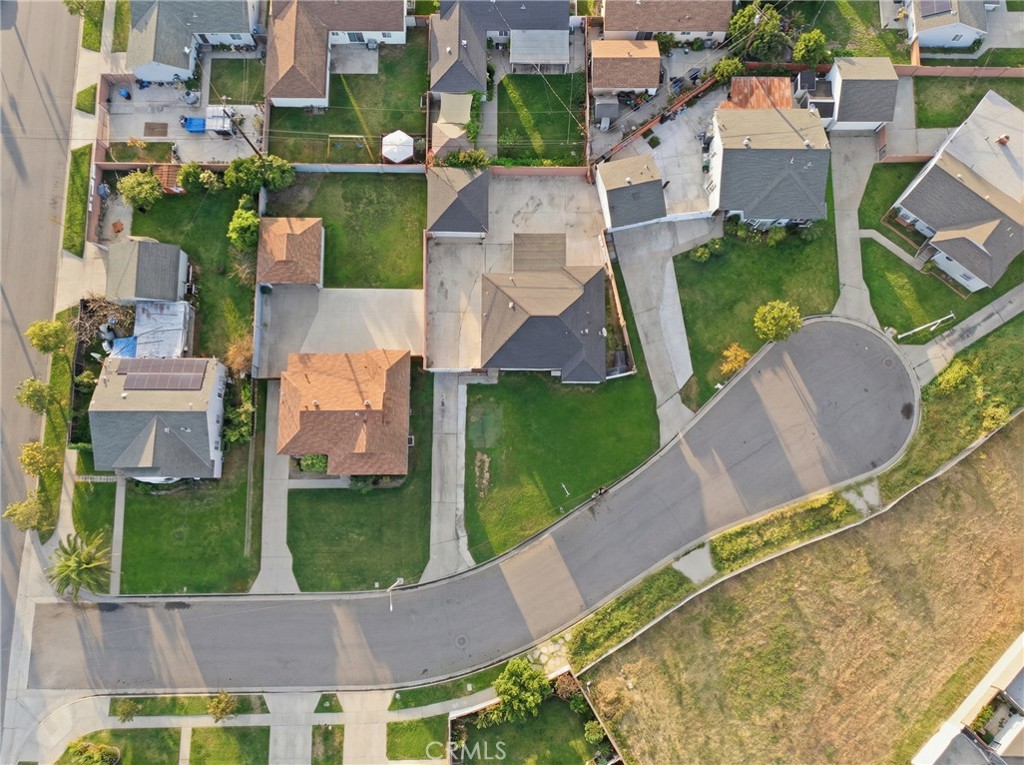 12817 Zeus Avenue Norwalk, CA 90650 - Photo 31 of 36 an aerial view of residential houses with outdoor space and swimming pool