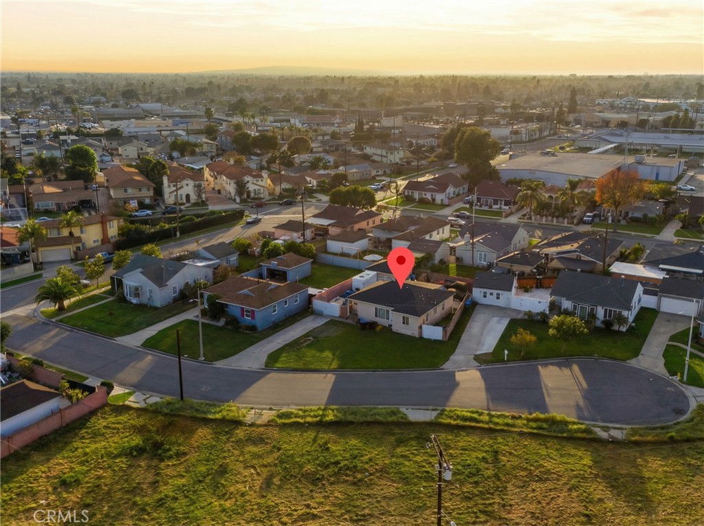 12817 Zeus Avenue Norwalk, CA 90650 - Photo 32 of 36 an aerial view of residential houses with outdoor space and swimming pool