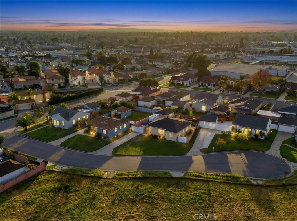 12817 Zeus Avenue Norwalk, CA 90650 - Photo 33 of 36 an aerial view of residential houses with outdoor space and lake view