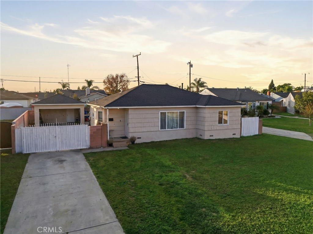 12817 Zeus Avenue Norwalk, CA 90650 - Photo 36 of 36 a front view of a house with a garden