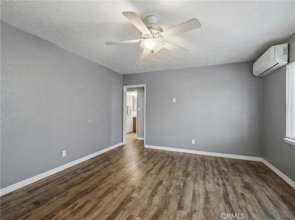 12817 Zeus Avenue Norwalk, CA 90650 - Photo 4 of 36 wooden floor in an empty room with a window