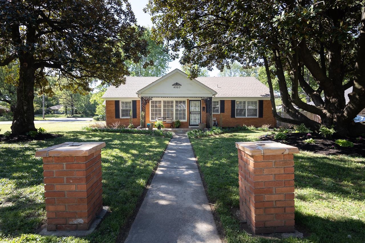 front view of a house with a yard