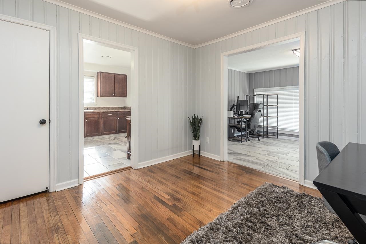 4983 Dee Road Memphis, TN 38117 - Photo 11 of 25 a view of a hallway and wooden floor a livingroom with wooden floor