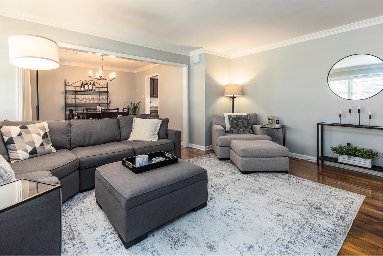 4983 Dee Road Memphis, TN 38117 - Photo 3 of 25 a living room with furniture and a large mirror next to a window