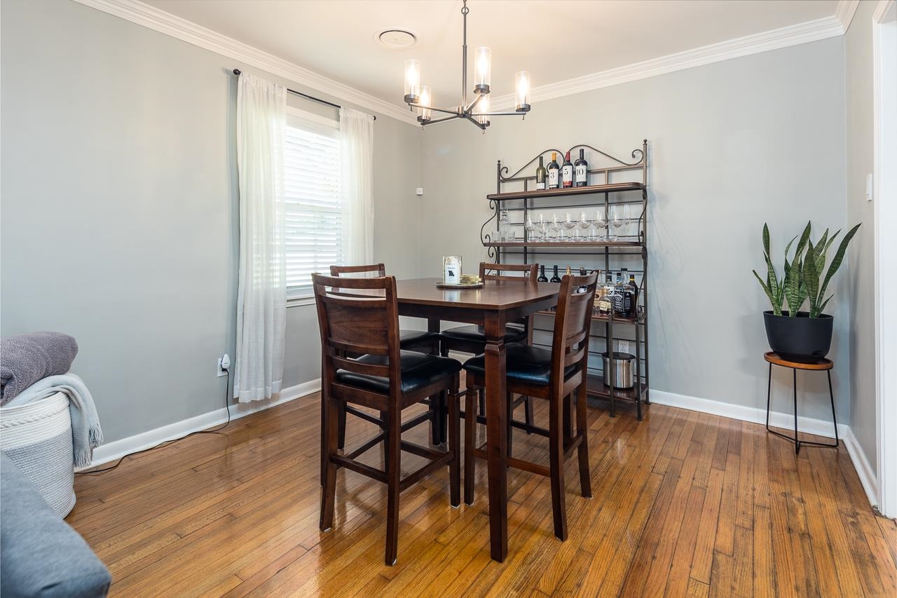 4983 Dee Road Memphis, TN 38117 - Photo 6 of 25 a view of a dining room with furniture window and wooden floor