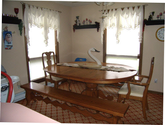 12233 Beaverton Road Poplar Grove, IL 61065 - Photo 3 of 6 a view of a dining room with furniture and a window