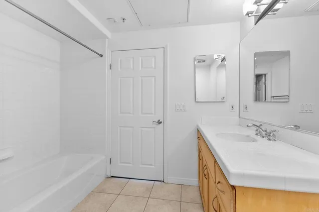 a bathroom with a bathtub and a sink
