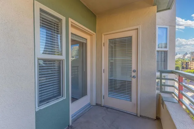 a view of a hallway with windows and entryway
