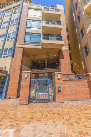 a view of a patio with dining table and chairs potted plants