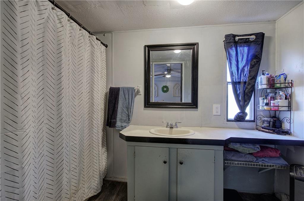 676 Flowery Branch Road Kingston, GA 30145 - Photo 21 of 96 a bathroom with a sink and a mirror