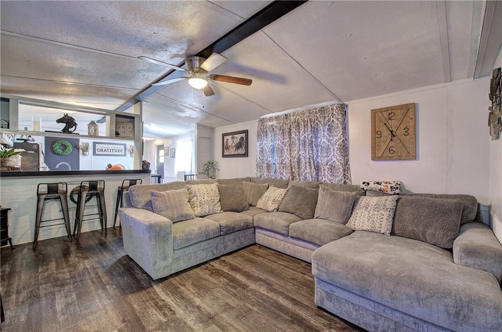 676 Flowery Branch Road Kingston, GA 30145 - Photo 8 of 96 a living room with furniture and a wooden floor