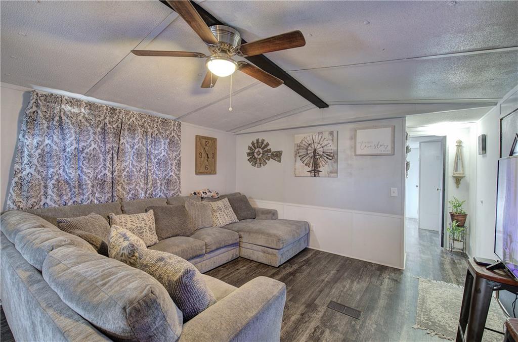 676 Flowery Branch Road Kingston, GA 30145 - Photo 10 of 96 a living room with furniture and a flat screen tv